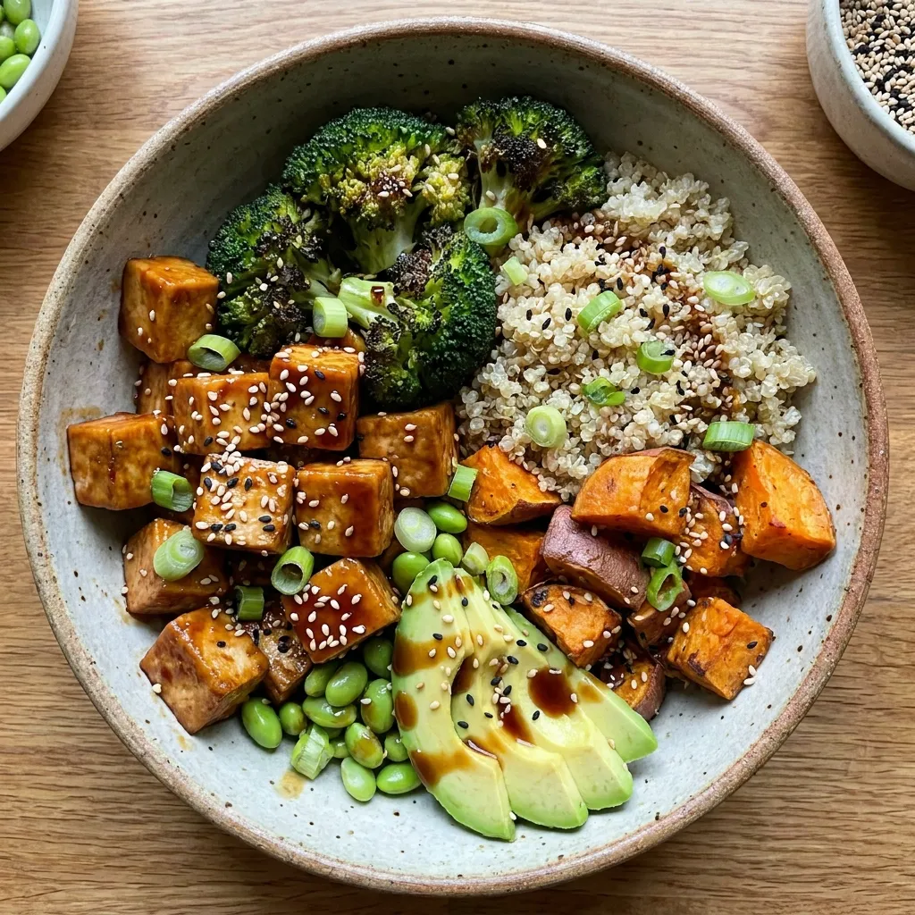 A nourishing teriyaki tofu quinoa bowl packed with roasted broccoli, sweet potatoes, and sesame seeds.