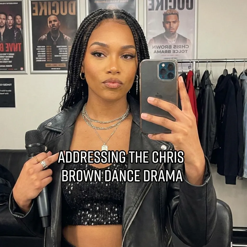 A woman taking a mirror selfie holding a microphone with the text overlay "ADDRESSING THE CHRIS BROWN DANCE DRAMA".