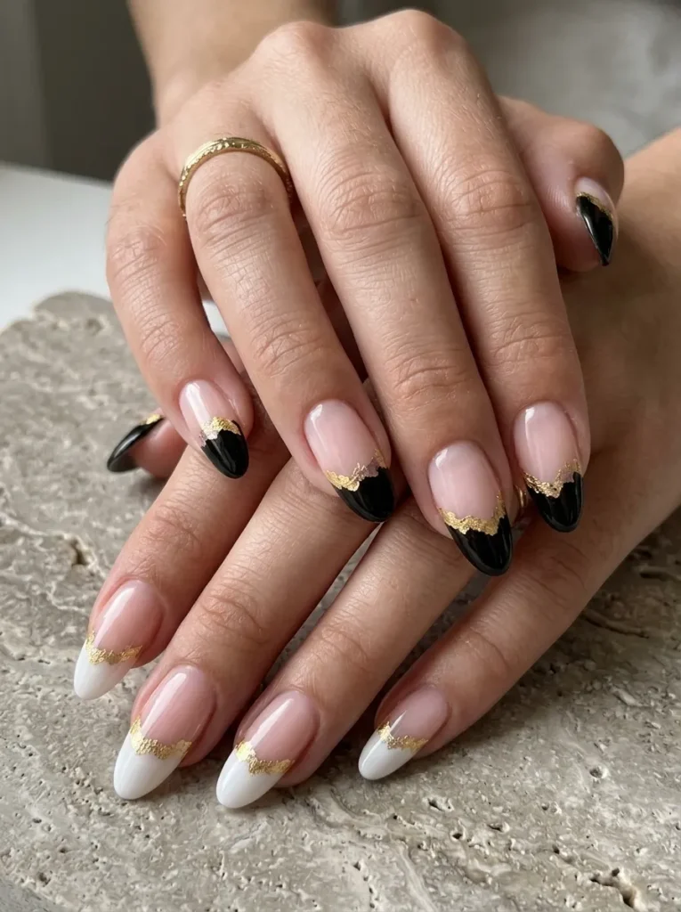 Black and white french manicure with gold foil accents